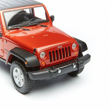 На картинке изображен Машинка Maisto 1:24 Jeep Wrangler (31268) met orange Машинка Maisto 1:24 Jeep Wrangler (31268) met orange