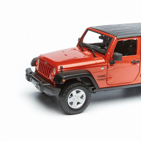На картинке изображен Машинка Maisto 1:24 Jeep Wrangler (31268) met orange Машинка Maisto 1:24 Jeep Wrangler (31268) met orange