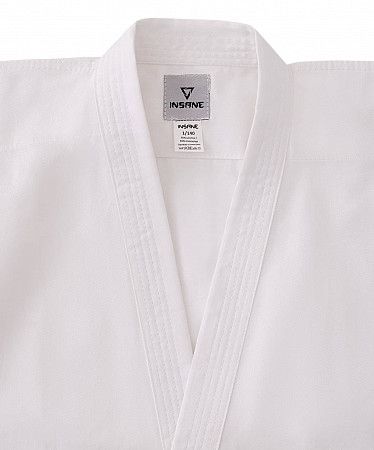 На картинке изображен Кимоно для карате Insane BASE KT100 хлопок/полиэстер 000/110 white Кимоно для карате Insane BASE KT100 хлопок/полиэстер 000/110 white