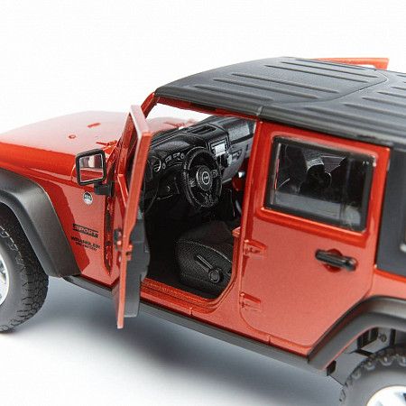 На картинке изображен Машинка Maisto 1:24 Jeep Wrangler (31268) met orange Машинка Maisto 1:24 Jeep Wrangler (31268) met orange
