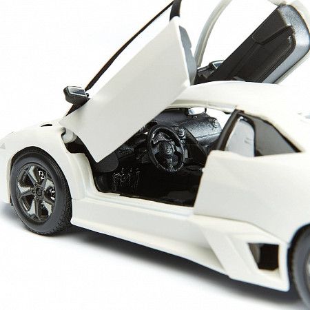 На картинке изображен Машинка Bburago 1:24 Lamborghini Reventon (18-21041) Машинка Bburago 1:24 Lamborghini Reventon (18-21041)